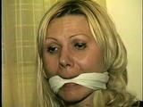 29 Yr OLD SEXY ROMANIAN TAPES AND CLEAVE GAGS HERSELF, HOPS AROUND THE ROOM BAREFOOT & IS CLEAVE GAGGED 3 MORE TIMES (D53-12)