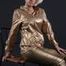Blonde archive girl posing in a studio wearing a sexy golden rainwear combination (Pics)