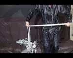 Watching Mara wearing sexy black rainwear during sorting her ropes for the next bondage session (Video)