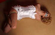 Barefoot Dolly is getting overpowered, bound and gagged on-screen