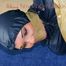 Jill tied, gagged and hooded on the floor with tape wearing an oldschool rain combination (Pics)