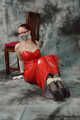 Bound in red PVC dress
