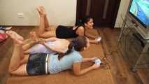 Lucky, La Pulya, Xenia - Gorgeous go-getters hogtie their cute friend to use her console (video)