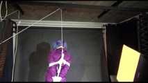 MARA tied and gagged overhead with ropes and a cloth gag wearing a super sexy super shiny purple rainsuit and blue rubber boots (Video)