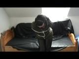 A video with Jill tied and gagged in a shiny nylon downjacket