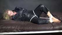 Watching Pia being tied and gagged with ropes and a clothgag wearing sex black shiny nylon suit (Video)