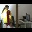 Brown-haired archive girl at homework wearing shiny nylon shorts and a rain jacket (Video)