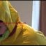 Jill tied and gagged on a stairrail wearing a sexy shiny yellow oldschool rainpants and rain jacket releasing herself (Video)