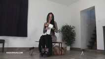 Mistress Cleo squirts cologne into the mouth of the slave lying in the toilet.