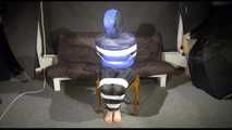 Watching SEXY MARA sitting on a chair being tied and gagged with tape and a clothgag and hood her the other way round (Video)