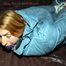 Katharina tied and gagged in a blue skisuit