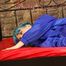 Mara posing on a princess bed in an old cellar wearing a green shiny nylon shorts and a blue rain jacket (Pics)