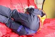*** HOT HOT HOT*** NEW MODELL*** DESTINY wearing a sexy blue/red shiny nylon rain suit and a life jacket ties and gagges herself with cuffs on a sofa (Pics)