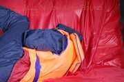 *** HOT HOT HOT*** NEW MODELL*** DESTINY wearing a sexy blue/red shiny nylon rain suit and a life jacket ties and gagges herself with cuffs on a sofa (Pics)