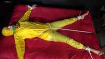 Watching sexy Pia being tied and gagged with ropes on a bed and a clothgag wearing sexy yellow shiny nylon rainwear (Video)