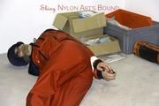 Shelly tied and gagged in shiny nylon rainwear