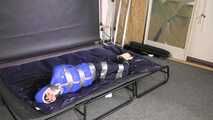 Lana tied and gagged in shiny nylon Rainwear desperately trying to free herself