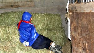 Katharina bound and gagged in shiny nylon rainwear