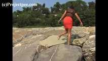016169 Eve Takes A Discrete Pee On The Rocks