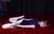 Agnes hogtied on bed