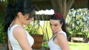 Jill and her friend having fun together outdoor both wearing shiny nylon shorts and a top (Pics)