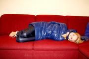 Samantha bound and gagged in a shiny nylon down coat