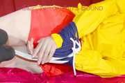 ***LUCIE*** wearing red/yellow shiny nylon shorts and a yellow shiny nylon rain jacket being bound on a sofa with ropes and a ball gag (Pics)