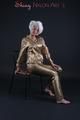 Blonde archive girl posing in a studio wearing a sexy golden rainwear combination (Pics)