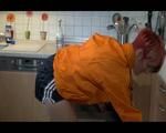 Sonja cleaning up the kitchen wearing a sexy black shiny nylon shorts and an orange rain jacket (Video)