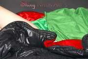 Lucy wearing sexy green shiny nylon shorts and a green rain jacket lolling on bed with a special cover (Pics)