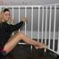 Sabrina posing on a stairway wearing a sexy shiny nylon shorts and playing with her black rain jacket (Pics)