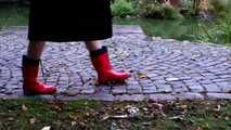 Fur coat and rubber boots - naked in the park