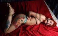 Nicole hogtied on bed