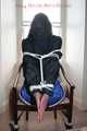 Stella being tied and gagged with ropes and a clothgag on a chair wearing a sexy shiny nylon short and a rain jacket (Pics)