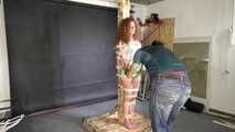 Beautifull Lola Montez tied and gagged very strictly to a post in shiny nylon Shorts