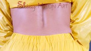 Blonde-haired archive girl wearing supersexy yellow rainwear while posing infront of the camera (Pics)