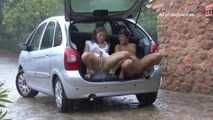 041004 Susana & Leticia Shelter In The Car To Pee Out The Rear Hatch.