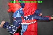 Sexy Sonja wearing a sexy oldschool shiny nylon downbib and donjacket being tied and gagged with ropes overhead (Pics)