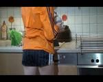 Sonja cleaning up the kitchen wearing a sexy black shiny nylon shorts and an orange rain jacket (Video)