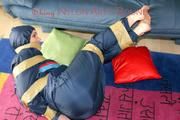 Jill tied, gagged and hooded on the floor with tape wearing an oldschool rain combination (Pics)