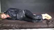 Watching Pia being tied and gagged with ropes and a clothgag wearing sex black shiny nylon suit (Video)