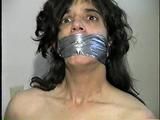 26 Yr OLD K-MART CLERK WRAP TAPE GAGGED WEARING BATHING CAP, MOUTH STUFFED. TIT TIED, CROTCH ROPED, NUDE, GARTER BELT & NYLON STOCKINGS TIGHTLY TIED TO A CHAIR (D63-13)