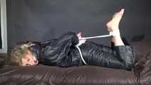 Watching Pia being tied and gagged with ropes and a clothgag wearing sex black shiny nylon suit (Video)