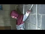 Nicole tied and gagged in a beautiful shiny silver/red PVC suit by Sophie in the cellar (Video)