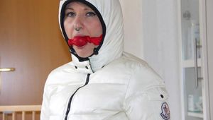 Mara tied and gagged on a chair in the corridor wearing sexy shiny nylon downwear (Pics)