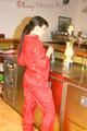 Jill posing sexy in an bar wearing sexy red shiny nylon rainwear (Pics)