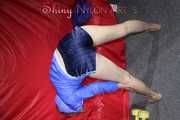 Watching sexy Sonja wearing a supersexy oldschool blue shiny nylon shorts and a lightblue rain jacket during her workout with barbells (Pics)