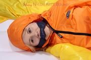 Samantha tied and gagged wearing shiny nylon rainwear (Pics)