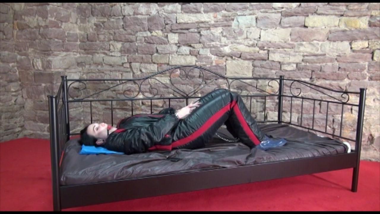 Jill Ties And Gagges Herself Sitting On A Princess Bed In An Old Cellar Wearing Sexy Black Shiny Nylon Down Wear (Video)