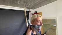 Lena buttplugged, bound and gagged in shiny Shorts and Windbreaker
